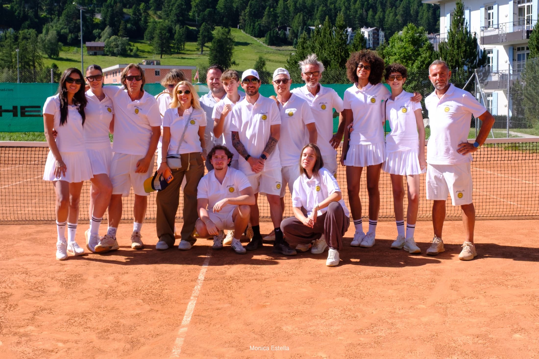Golden Era players and organisers gathered together on a clay court