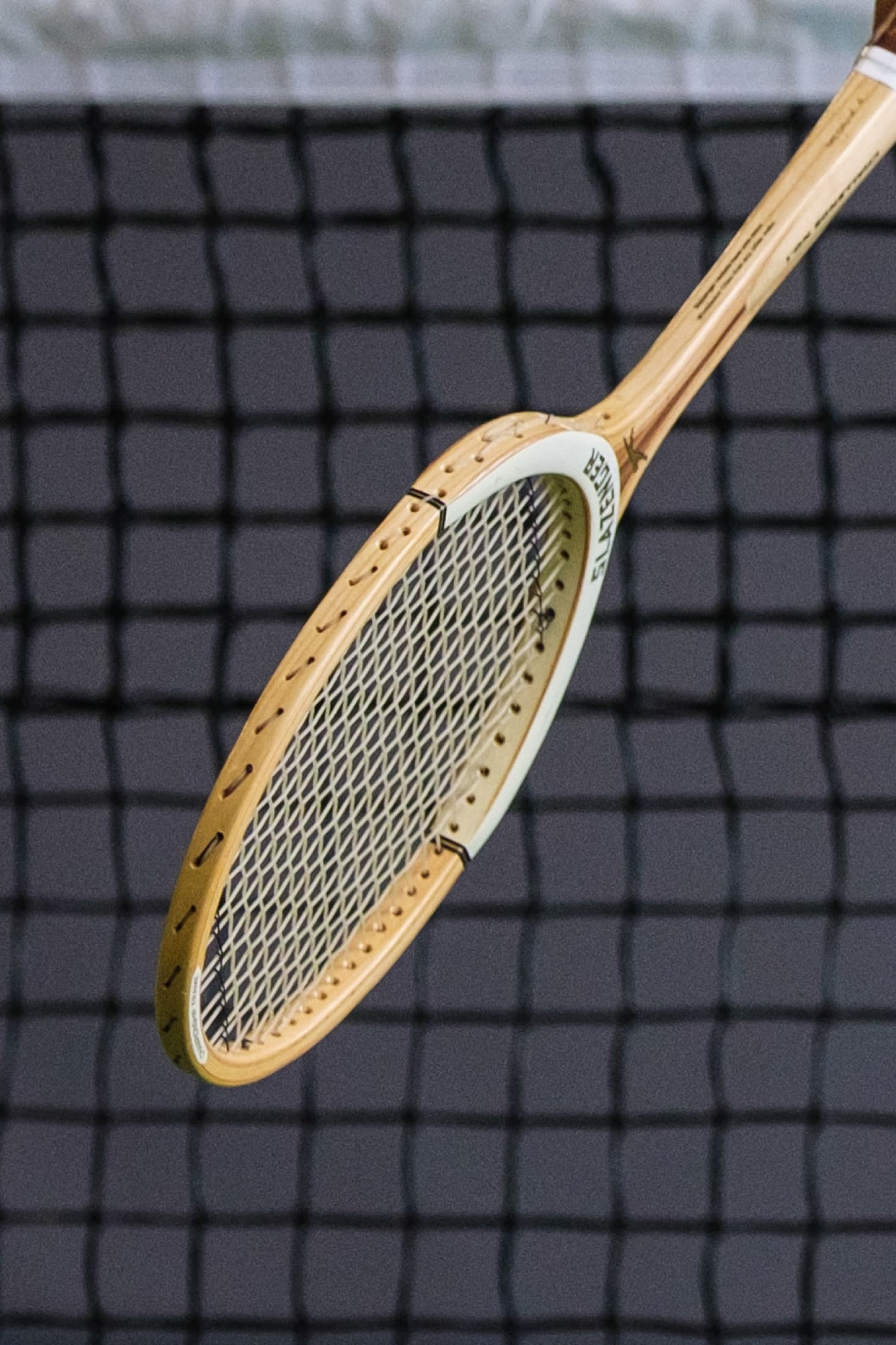 Close-up of a historic wooden tennis racquet from the Golden Era collection